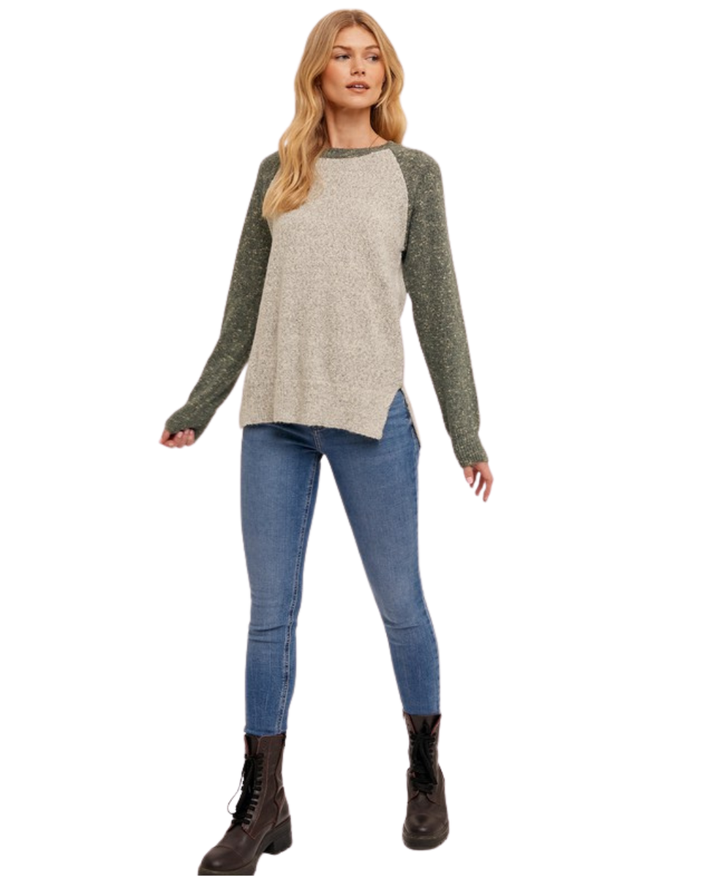 Woman wearing a gray and green Raglan sweater on a white background