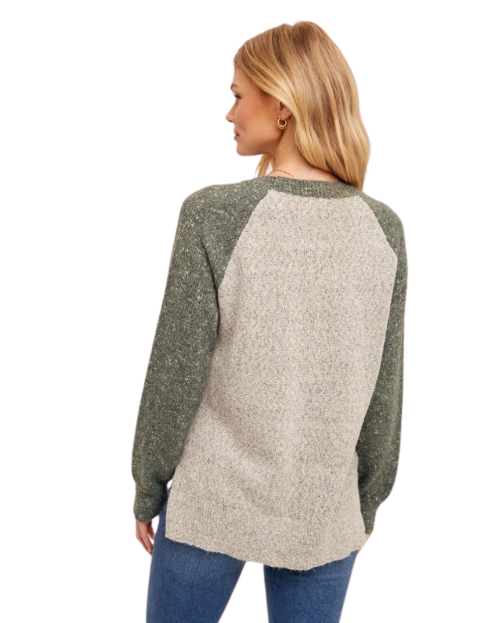 Woman wearing a two-tone sweater with green sleeves and beige body on a white background