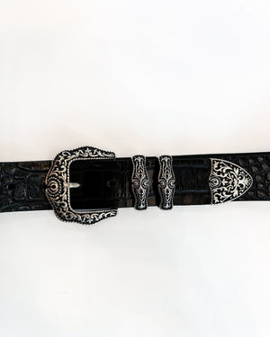 Black belt with silver buckle on a white background