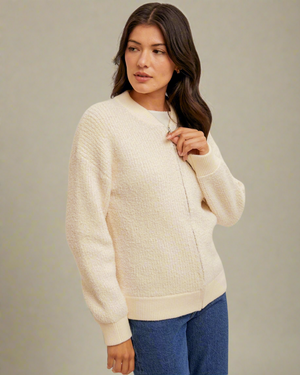 women in ivory sweater