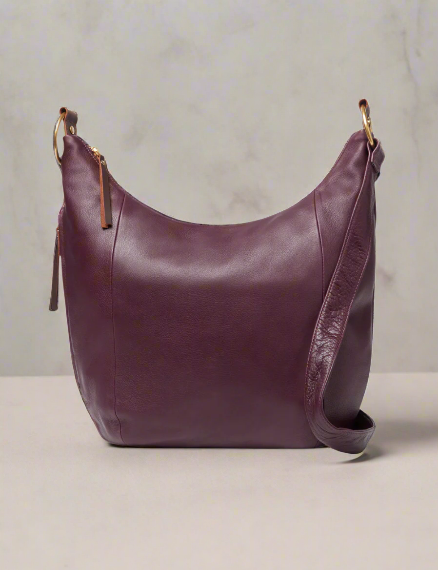 Brown leather handbag on a white background