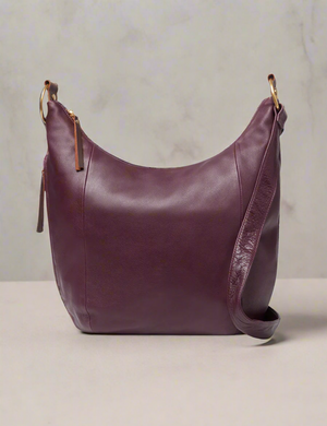 Brown leather handbag on a white background