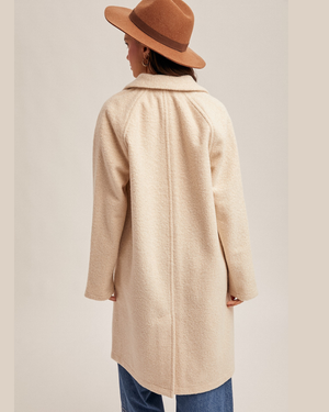 back of ecru coat