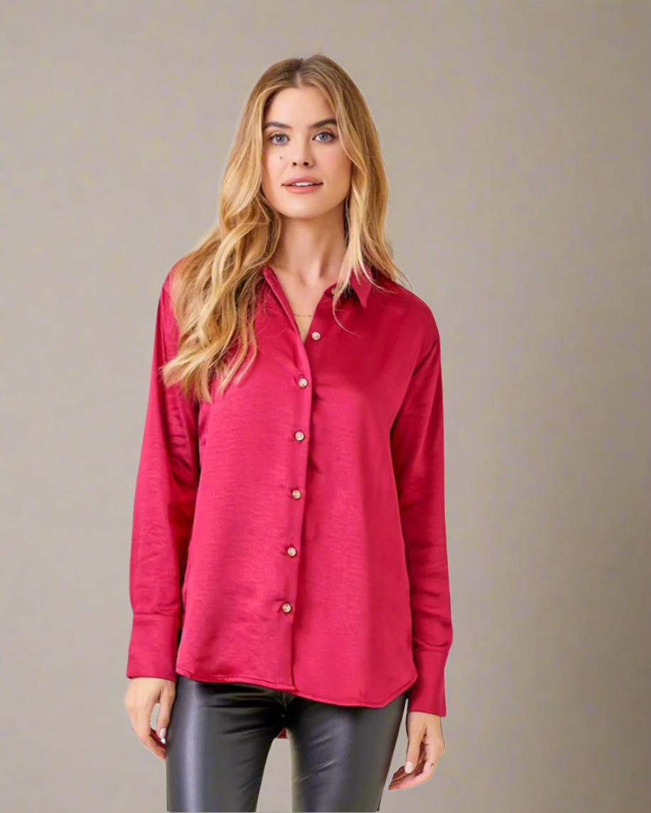 Woman wearing a red button-up shirt on a white background