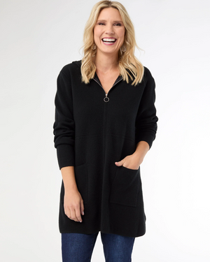 Woman wearing a black zip-up hoodie on a white background