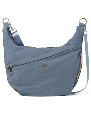 Blue shoulder bag with gold zippers on a white background