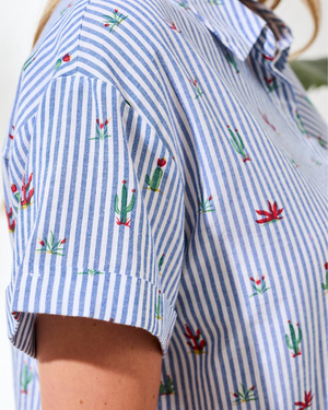 Blue and white striped shirt with cactus print