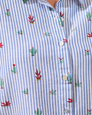 Close-up of a blue and white striped shirt with cactus pattern