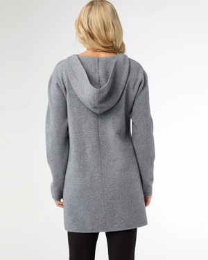 Person wearing a gray hooded coat on a white background