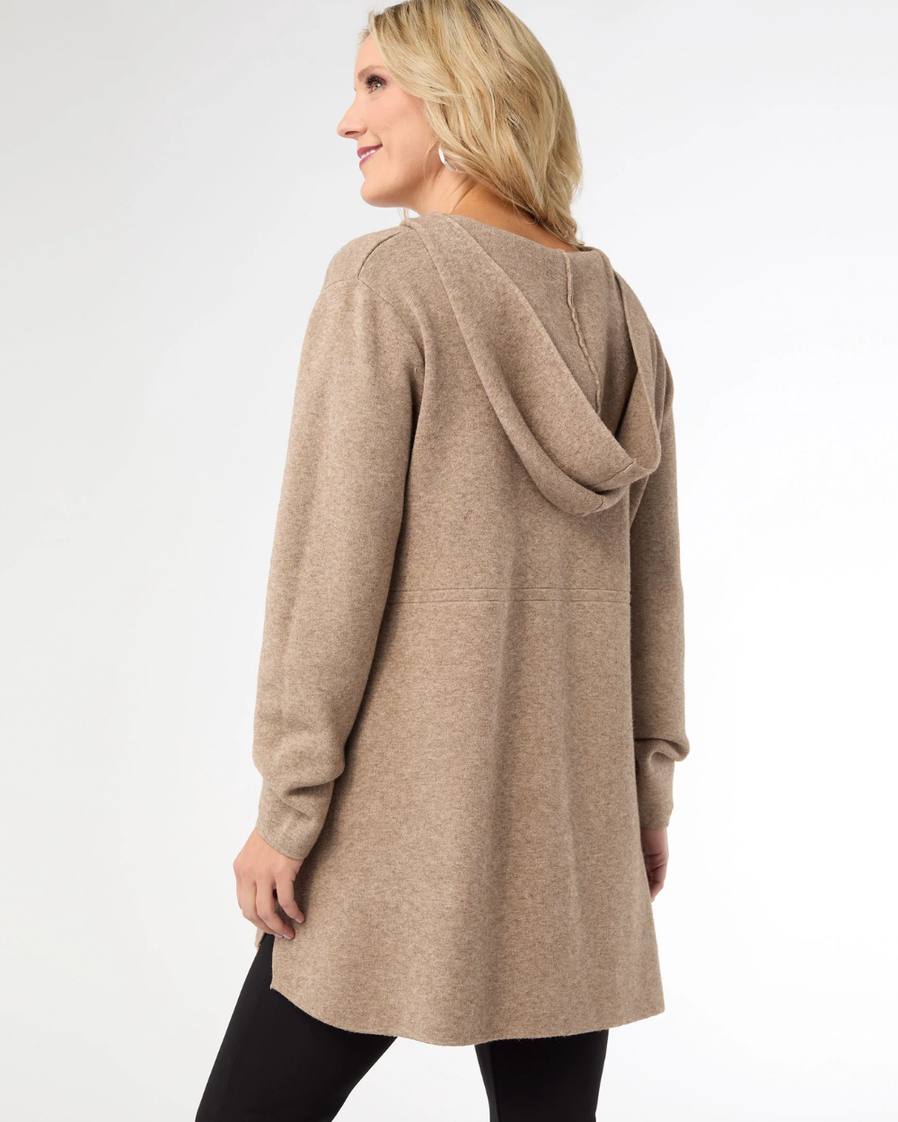 Woman wearing a beige hooded cardigan on a white background