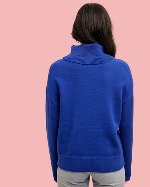 women in blue turtleneck sweater